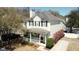Charming two-story home features a covered front porch, landscaped yard, and private driveway at 2369 Chadbury Ln, Mount Pleasant, SC 29466