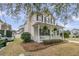 Charming home with a welcoming front porch, professionally landscaped yard and inviting curb appeal at 2369 Chadbury Ln, Mount Pleasant, SC 29466