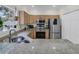 Bright kitchen with stainless steel appliances, granite counters and a double basin sink under the window at 2369 Chadbury Ln, Mount Pleasant, SC 29466