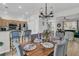 Living room with dining area, blue seating, wood floors, and a stairway at 2369 Chadbury Ln, Mount Pleasant, SC 29466