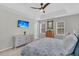 Spacious main bedroom with a tray ceiling, ceiling fan, carpet, and a comfortable bed with a floral pattern at 2369 Chadbury Ln, Mount Pleasant, SC 29466