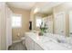 Spacious bathroom with double vanity, marble countertop, white cabinets, and a neutral color scheme at 263 Stefan Dr, Charleston, SC 29412