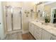 Bright bathroom featuring double sinks, marble countertops, and a walk-in shower at 263 Stefan Dr, Charleston, SC 29412