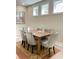 Elegant dining room with a wood table, upholstered chairs, and neutral tones at 263 Stefan Dr, Charleston, SC 29412