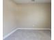 An empty room with neutral-colored walls, light gray carpet, and white baseboards, ready for personalization at 263 Stefan Dr, Charleston, SC 29412