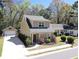 Charming two-story home with well-manicured lawn, red door, and detached garage with basketball hoop at 263 Stefan Dr, Charleston, SC 29412