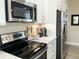 Updated kitchen features stainless appliances, marble countertops, and sleek cabinetry at 263 Stefan Dr, Charleston, SC 29412