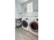 Bright laundry room featuring modern appliances, stylish shelving, and ample counter space at 263 Stefan Dr, Charleston, SC 29412