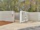 Community dumpsters enclosed with a privacy fence for trash and bulk item disposal at 268 Alexandra Dr # 9, Mount Pleasant, SC 29464