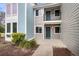 Exterior view of home featuring private balcony, neutral siding, and a well-maintained walkway at 268 Alexandra Dr # 9, Mount Pleasant, SC 29464