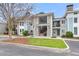 Inviting exterior of multi-story condo buildings with well-maintained landscaping, creating an appealing curb appeal for residents at 268 Alexandra Dr # 9, Mount Pleasant, SC 29464