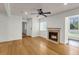 Bright living room featuring hardwood floors, ceiling fan, and a fireplace at 268 Alexandra Dr # 9, Mount Pleasant, SC 29464