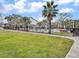 Community pool surrounded by a black fence, and green grass, ideal for enjoying leisurely afternoons in a beautiful setting at 268 Alexandra Dr # 9, Mount Pleasant, SC 29464