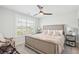 Neutral bedroom featuring a cozy bed, bright windows and stylish decor for a warm and inviting feel at 2916 Cavalcade Cir, Johns Island, SC 29455