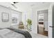 Bedroom featuring a stylish chair near a bright window and a view into the bedroom next door at 2916 Cavalcade Cir, Johns Island, SC 29455