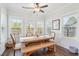 Bright dining area featuring many windows, wood flooring, and modern decor at 2916 Cavalcade Cir, Johns Island, SC 29455