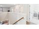 Hallway featuring wood floors and white walls with a view to the dining area below at 2916 Cavalcade Cir, Johns Island, SC 29455