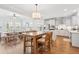 Bright kitchen and breakfast area with white cabinets and wood flooring at 2916 Cavalcade Cir, Johns Island, SC 29455