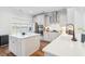 Modern kitchen with white cabinets, stainless steel appliances, an island and stylish fixtures providing ample counter space and storage at 2916 Cavalcade Cir, Johns Island, SC 29455