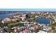 Beautiful aerial view of the neighborhood showcases its charming homes, the river, and nearby tennis courts and lake at 301 Broad St # 1, Charleston, SC 29401