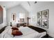 Charming bedroom with vaulted ceiling, desk, large windows, and artistic décor, creating a peaceful retreat at 301 Broad St # 1, Charleston, SC 29401