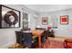 Elegant dining room with a modern table, artwork, and natural light, complemented by a stylish rug at 301 Broad St # 1, Charleston, SC 29401