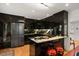 Modern kitchen features high-gloss cabinetry, stainless steel appliances, and a sleek breakfast bar at 301 Broad St # 1, Charleston, SC 29401
