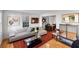 Bright living room features hardwood floors, contemporary furnishings, and natural light from large windows at 301 Broad St # 1, Charleston, SC 29401