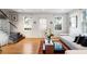 Bright living room featuring hardwood floors, contemporary furnishings, and natural light from large windows at 301 Broad St # 1, Charleston, SC 29401