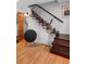 Stylish staircase with dark wood steps, glass railings, and black accents leading to upper floors at 301 Broad St # 1, Charleston, SC 29401