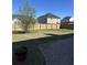 Large backyard with a brick paver patio and a wooden fence at 3059 Adventure Way, Ladson, SC 29456