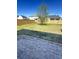Spacious backyard with brick paver patio, lawn, and wooden fence at 3059 Adventure Way, Ladson, SC 29456