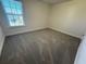 Bright and airy bedroom featuring a large window for natural light and plush carpeting at 3059 Adventure Way, Ladson, SC 29456