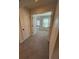 Through the doorway a bedroom view reveals gray carpeting, light walls, and a bright window at 3059 Adventure Way, Ladson, SC 29456