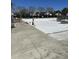 Community swimming pool being prepped for summer, featuring lounge chairs and nearby neighborhood residences at 3059 Adventure Way, Ladson, SC 29456