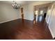 An open-concept living room showcases stunning hardwood floors and is bathed in natural light at 3059 Adventure Way, Ladson, SC 29456