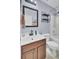 Standard bathroom featuring a single sink vanity, combination tub and shower, and ceramic tile flooring at 306 Slow Mill Dr, Goose Creek, SC 29445
