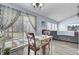 Cozy dining area with sliding doors leading to a screened porch and backyard at 306 Slow Mill Dr, Goose Creek, SC 29445