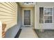 Inviting front entrance with a dark door, landscaping, and a well-maintained walkway at 306 Slow Mill Dr, Goose Creek, SC 29445