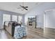 Comfortable living room with vaulted ceilings, large windows, and a modern entertainment center at 306 Slow Mill Dr, Goose Creek, SC 29445