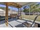 Relaxing screened-in porch with wooden beams and a swing, offering a cozy outdoor retreat at 306 Slow Mill Dr, Goose Creek, SC 29445