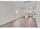 Open-concept living room and kitchen with modern recessed lighting and wood-look floors at 312 Pine Crest View Dr, Summerville, SC 29486
