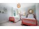 Bright bedroom featuring two beds, decorative mirrors, and neutral tones at 313 Pine Crest View Dr, Summerville, SC 29486