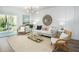 Bright living room featuring wicker chairs, a glass coffee table, and neutral decor at 313 Pine Crest View Dr, Summerville, SC 29486