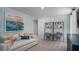 Cozy living room with a comfortable sofa, colorful decor, and a dedicated workspace at 313 Pine Crest View Dr, Summerville, SC 29486