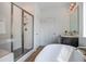 Bright bathroom with glass shower, modern fixtures, and standalone tub at 339 Trailmore Ln, Summerville, SC 29486