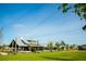 Exterior view of neighborhood clubhouse featuring a beautiful blue sky and a luscious green lawn at 339 Trailmore Ln, Summerville, SC 29486