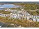 Stunning aerial view of the neighborhood, showing houses, waterways, and lush greenery at 384 Blowing Fresh Dr, Charleston, SC 29492