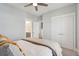 Large bedroom with a view into the ensuite bathroom, staircase, ceiling fan, and neutral walls at 384 Blowing Fresh Dr, Charleston, SC 29492