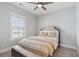 Comfortable bedroom with a bed, side bench, and window offering plenty of natural light at 384 Blowing Fresh Dr, Charleston, SC 29492